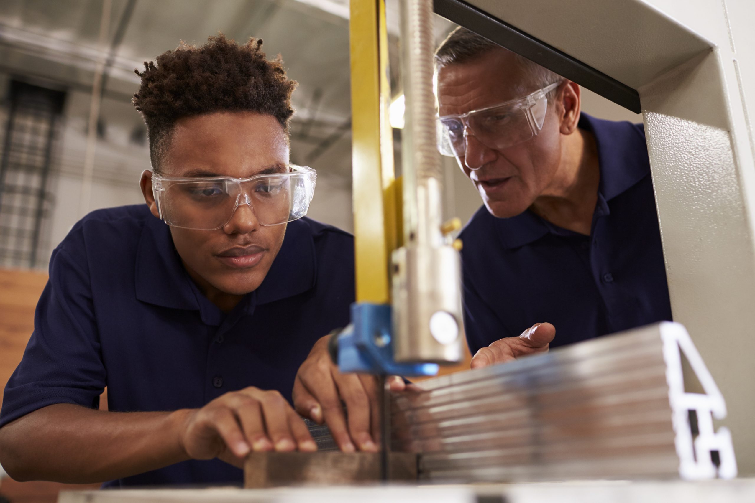 Mentor works with young entry level worker